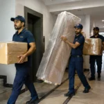 Professional Movers and Packers in Karachi safely loading household furniture into a moving truck for residential relocation by Mazdawala